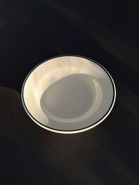 Tuxton Blue Line deep rim soup plate in eggshell white with hand-painted blue band.