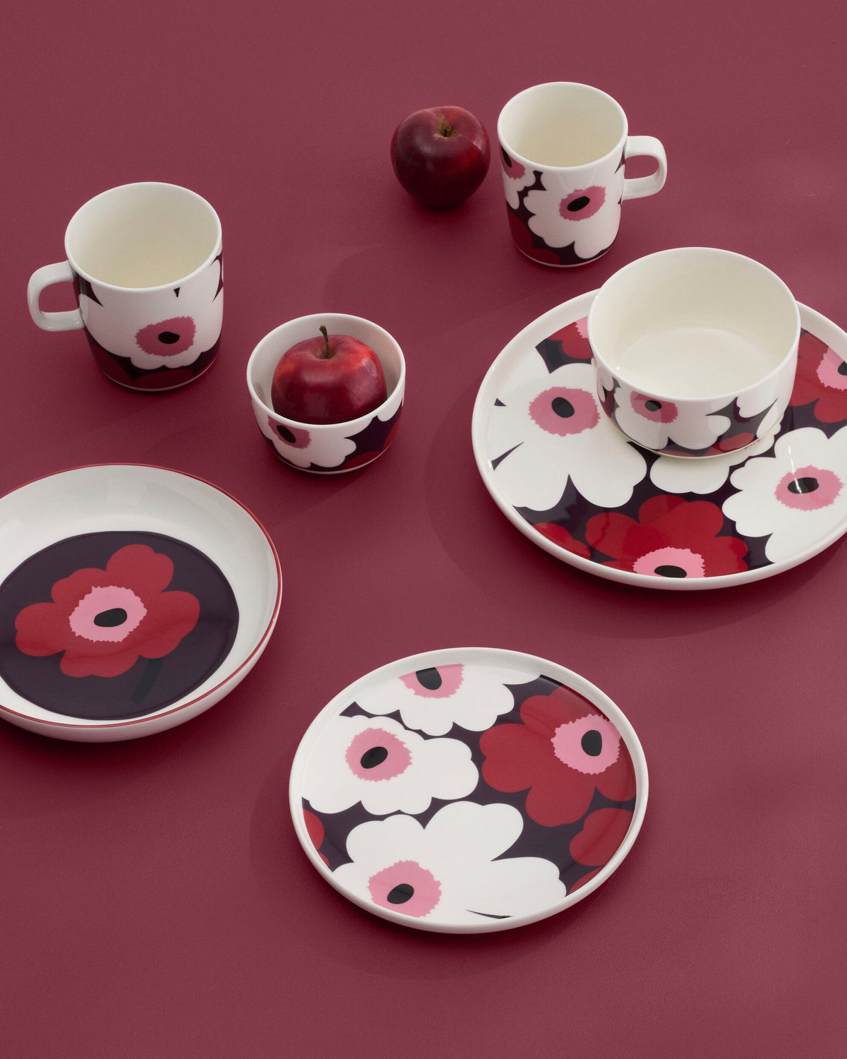 Marimekko Oiva collection from Fall Winter 2026 featured on a cranberry table setting.