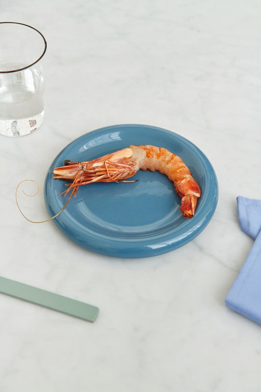 Hay Barro Plate 18cm in Dark blue, serving a prawn.