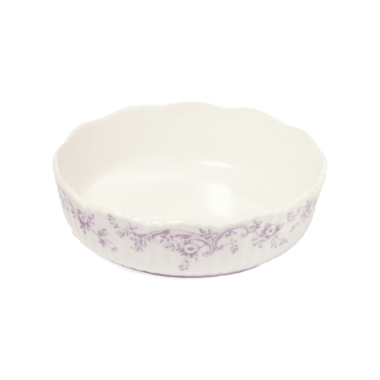 A pack shot of Studio M' Audrey Cake Pan in porcelain, featuring a scalloped lace-like rim and an English garden-inspired floral relief pattern.
