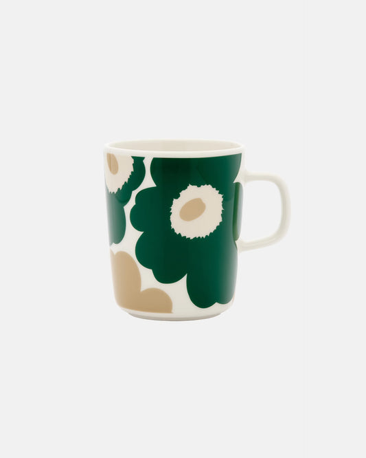 Side-angle view of the Marimekko Oiva 250ml white stoneware mug featuring the iconic Unikko poppy print in dark green, beige, and light sand.