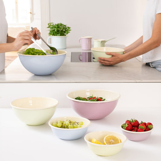 A lifestyle shot of Riess enamel bowls used for prepping meals.
