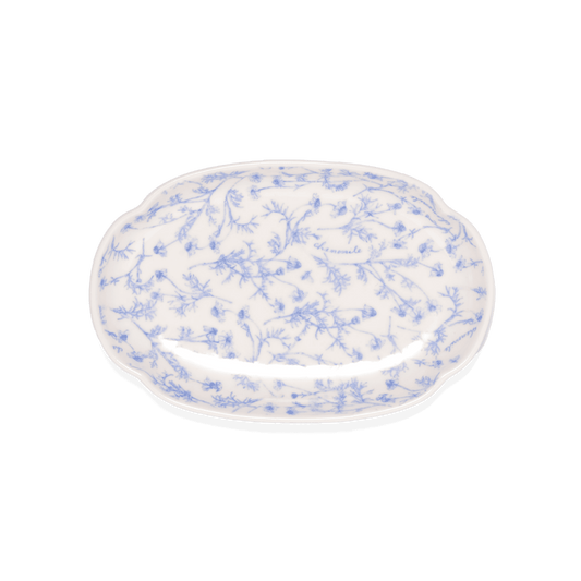 A pack shot of Studio M' Chamomile Oval Plate in white porcelain, featuring a vintage blue floral pattern and a gently curved traditional Japanese Mokkou shape.
