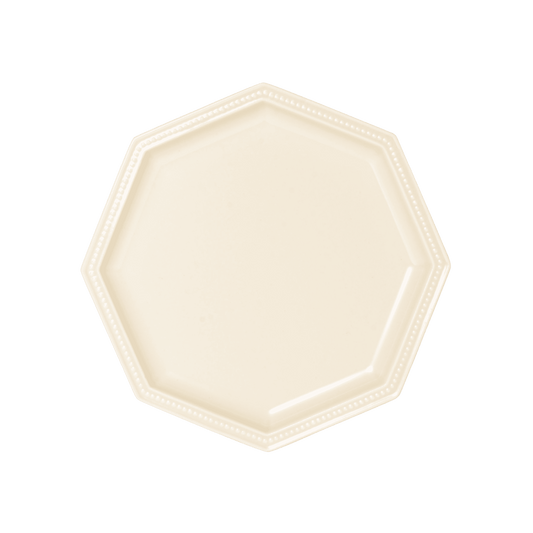 Studio M' Gatis Plate in a warm cream glaze, featuring an octagonal shape with a dotted rim detail, perfect for minimalist Scandi table settings.