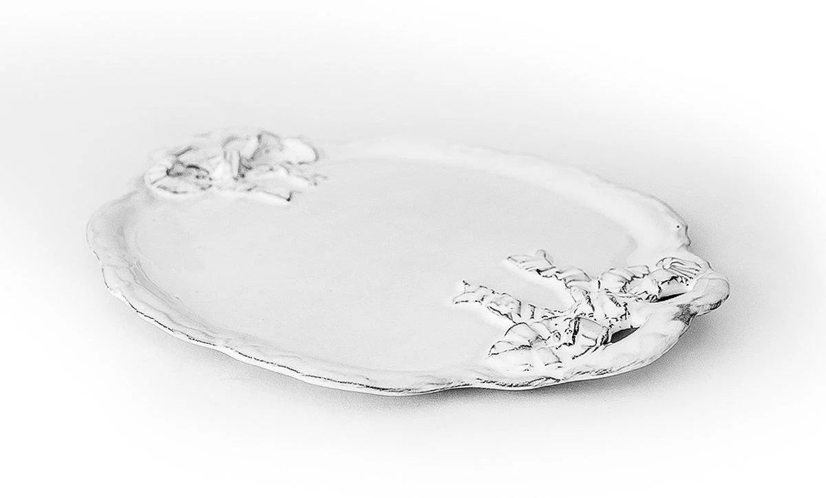 Side-angle of CARRON Paris large Marie-Antoinette white ceramic serving platter with handle detail