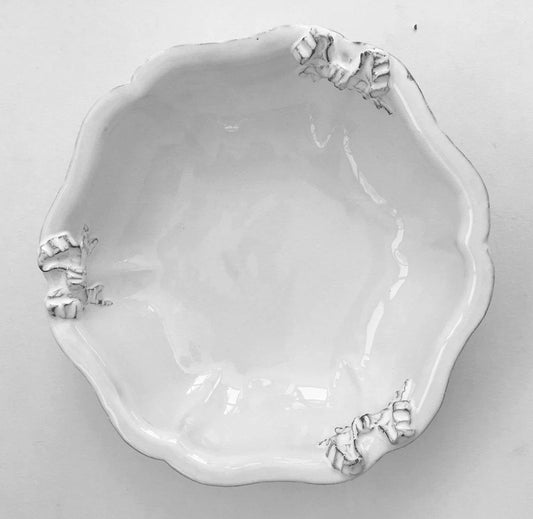 Carron Paris Marie-Antoinette ribbon salad bowl in white enameled terracotta. A shot taken from the high angle.