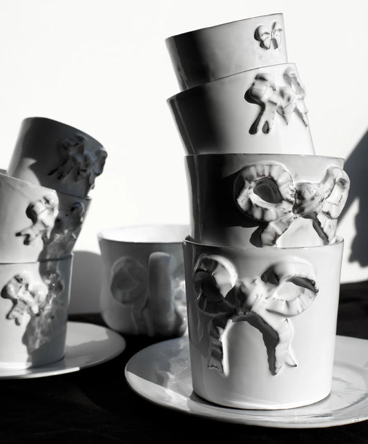 Carron Paris ceramic mug with a delicate embossed ribbon design for coffee and tea, in multiple sizes.