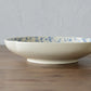 A shot of Studio M' Chamomile Deep Plate from the side angle. 