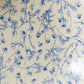 A close-up shot of Studio M' Chamomile Oval Plate, showcasing the details of the floral patterns. 