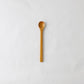 A pack shot of Studio M Kurinoki Japanese natural chestnut wood honey spoon.