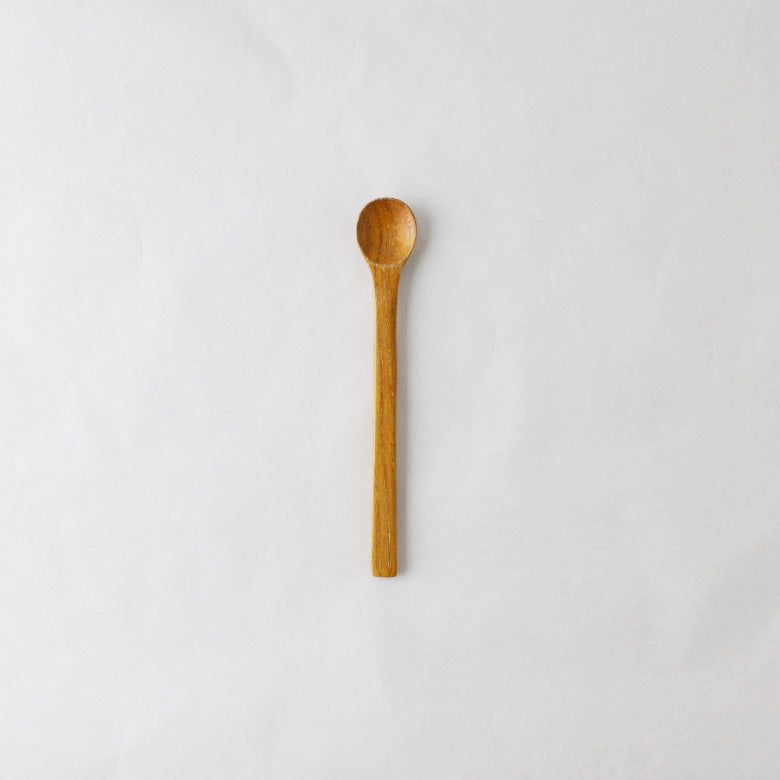 A pack shot of Studio M Kurinoki Japanese natural chestnut wood honey spoon.