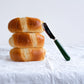 Three breed rolls with Sabre Paris Pop Unis butter spreader in Green