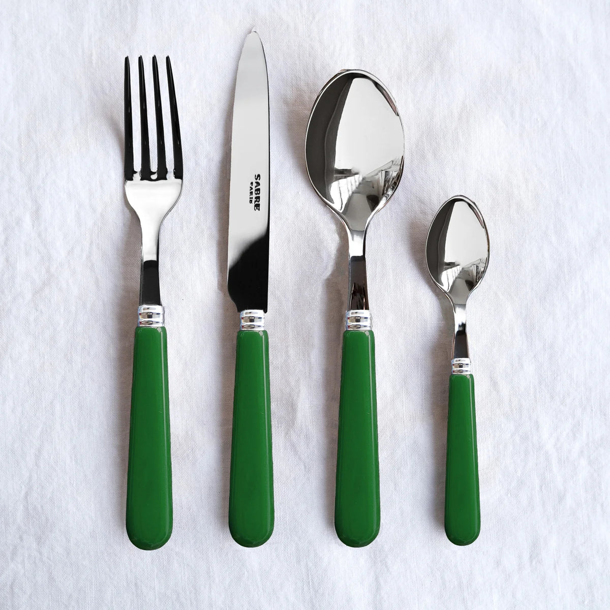 Flat-layered Sabre Paris Pop Unis 4 piece set in Green. 