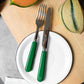Sabre Paris Pop Unis cutelery set on a white dish.