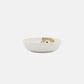 Side view of Marimekko Oiva Unikko 16cm stoneware dish in beige sand and dark green