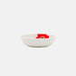 Side angle of Marimekko Oiva Unikko 16cm stoneware deep dish in vibrant white red and blue