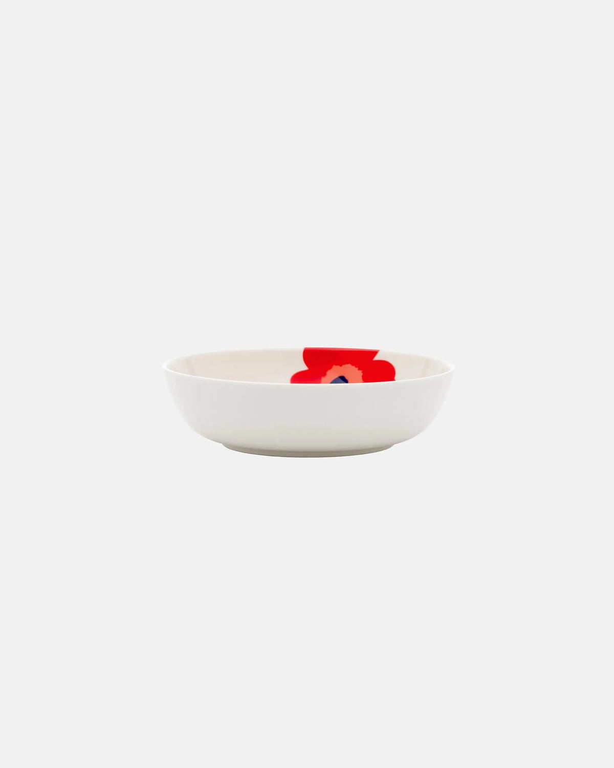 Side angle of Marimekko Oiva Unikko 16cm stoneware deep dish in vibrant white red and blue