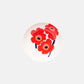 Aerial angle of Marimekko Oiva Unikko 16cm stoneware deep dish in vibrant white red and blue