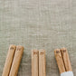A close up shot of the detail of Studio M' logo at the end of the Studio M' Gros Chestnut Chopsticks 23cm.