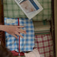 An overhead view Hotel827 cotton travel pouches in different sizes and patterns. 