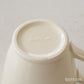 The base of Studio M' Creamware Latte Mug.