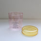 HÔTEL827 pink glass storage jar with lid off.