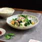 Studio M' Chamomile Deep Plate in a lunch table setting. 