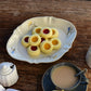 Studio M' Mignardises Plate in a beautiful smooth glaze, serving desserts in an afternoon tea table setting.
