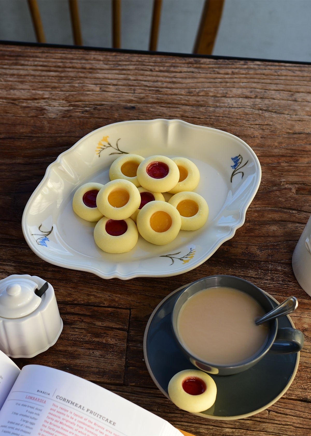 Studio M' Mignardises Plate in a beautiful smooth glaze, serving desserts in an afternoon tea table setting.
