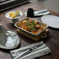 Studio M' Malta Oval Plate 28cm in a stunning white glaze, on a table setting paired with same plate in green. 