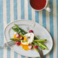 Studio M' Malta Oval Plate 28cm in a stunning white glaze, in a lunch table setting.