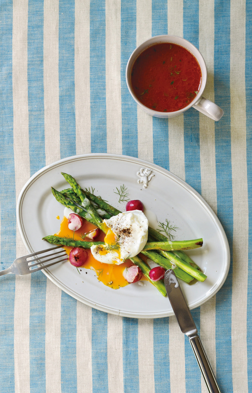 Studio M' Malta Oval Plate 28cm in a stunning white glaze, in a lunch table setting.