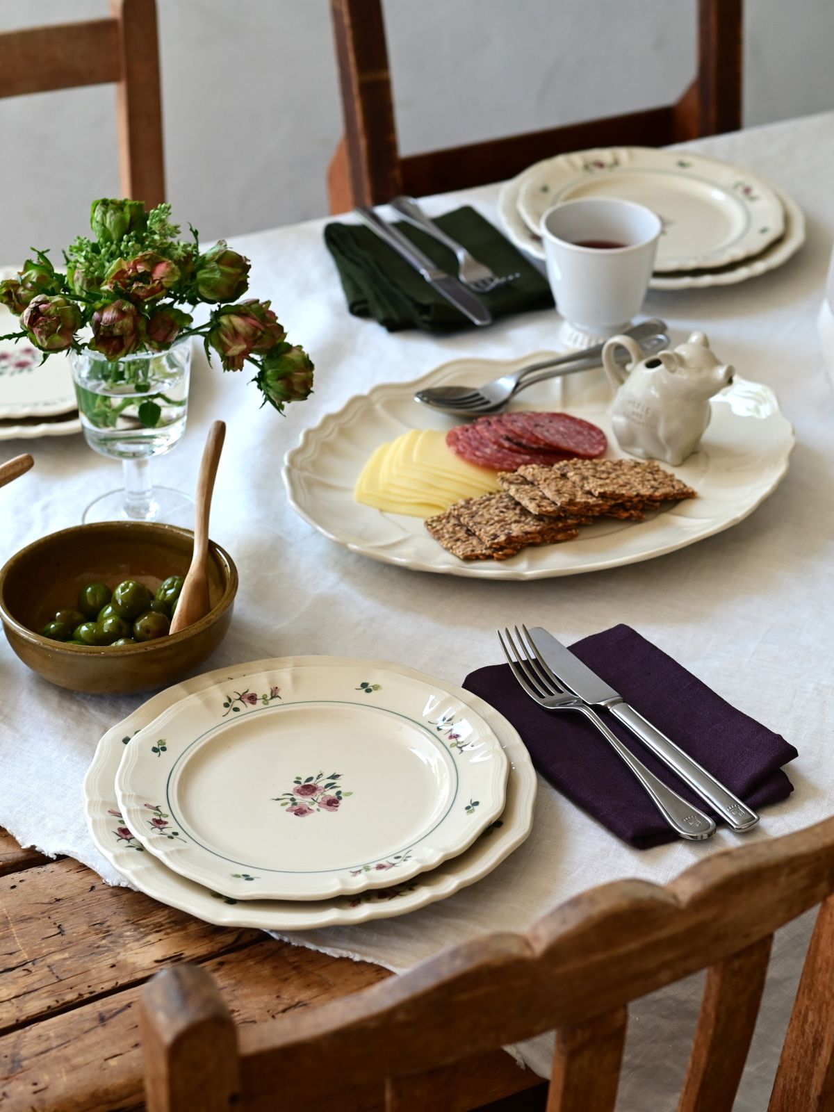 Studio M' Rosier Plate 24cm in a warm, subtle beige glaze, paired with 20cm plate in a table setting.