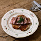 Studio M' Rosier Plate 24cm in a warm, subtle beige glaze, add a touch of elegance to your table. 