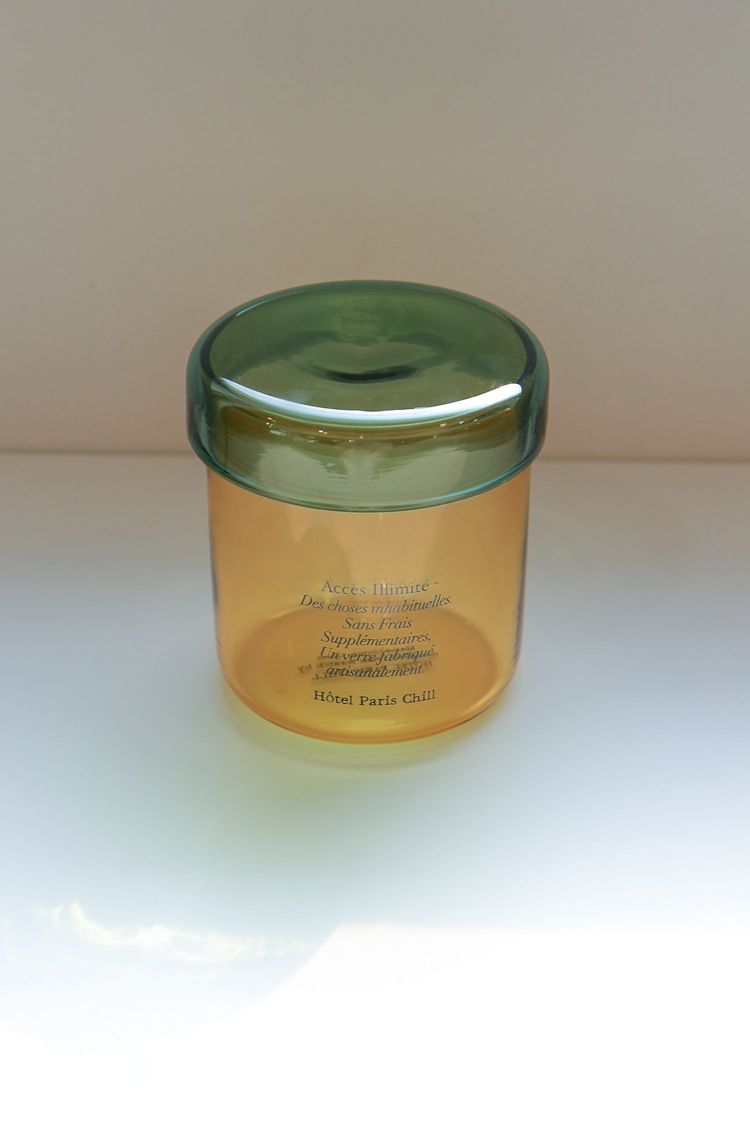 Aerial view of HÔTEL827 Overhaze Vanilla mouth blown borosilicate glass jar container with lid