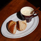 Studio M' Malta Oval Plate 28cm in a stunning white glaze, serving breakfast.