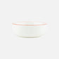 Aerial-angle view of the Marimekko Oiva 400ml white stoneware bowl featuring the iconic Unikko poppy print in light blue, orange, and red.