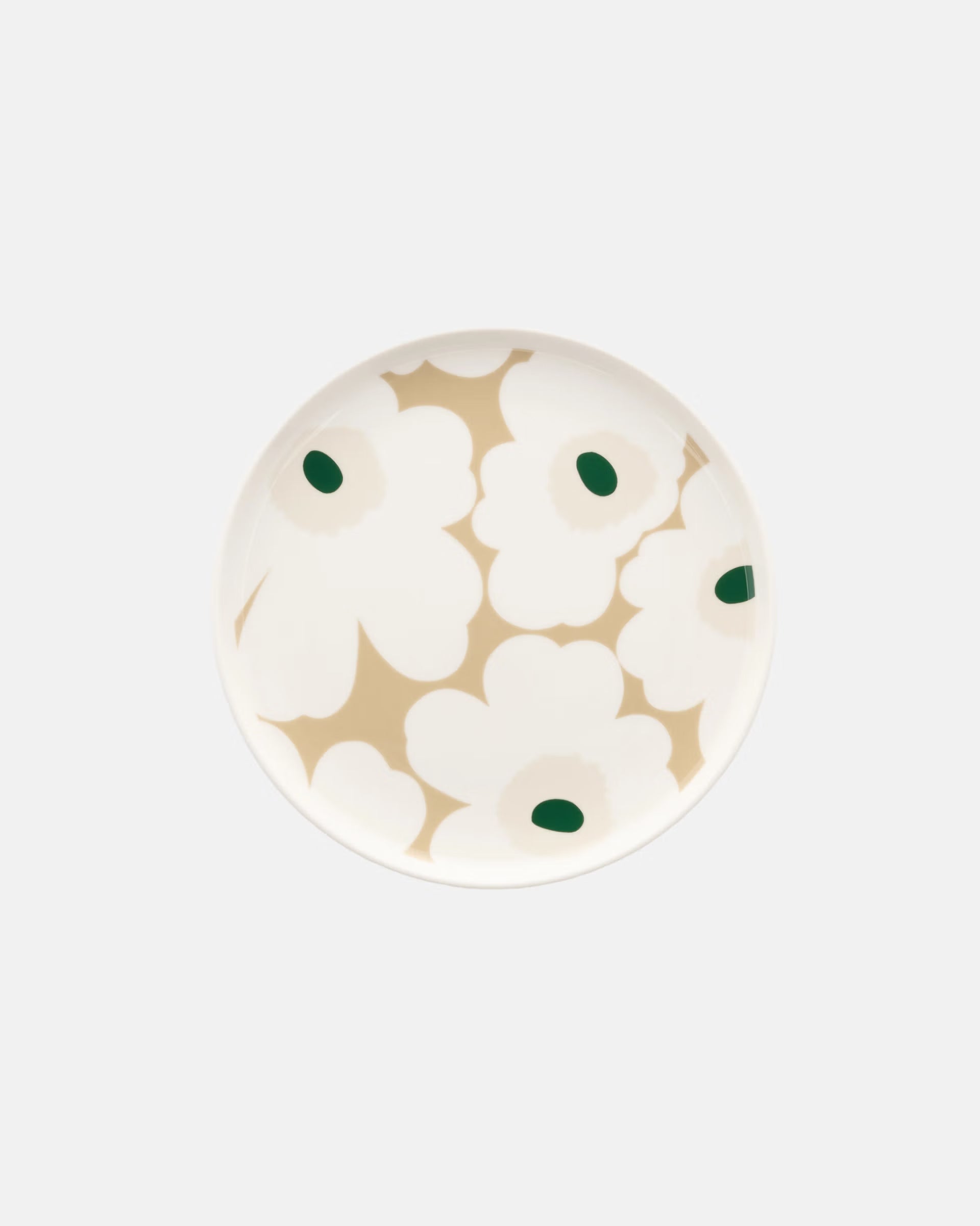 Overhead view of the Marimekko Oiva 20cm white stoneware plate featuring the iconic Unikko poppy print in dark green, beige, and light sand.