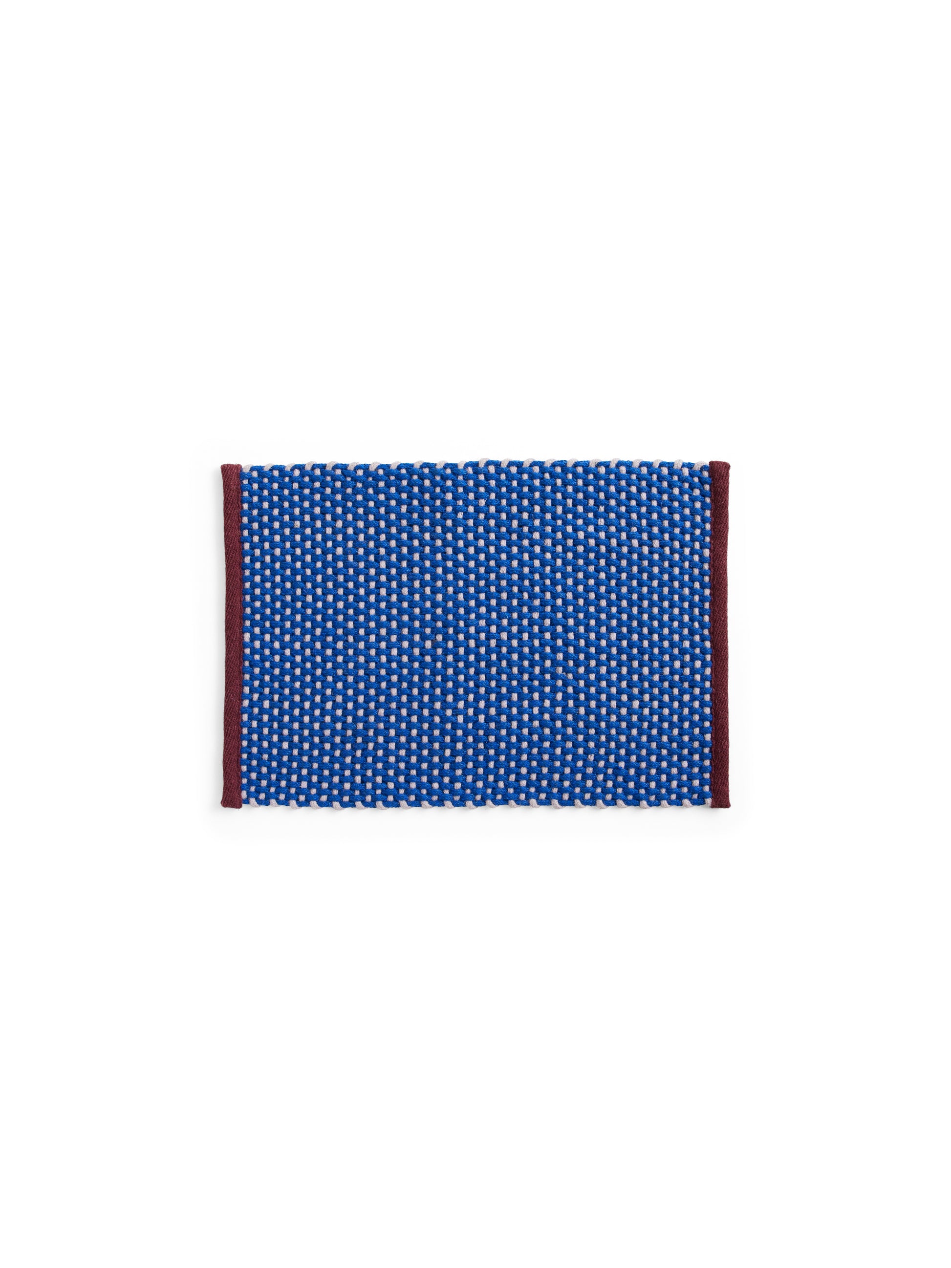 Overhead view of the HAY rectangular door mat in royal blue, showcasing its textured two-tone jute weave and contrasting wool border trim.
