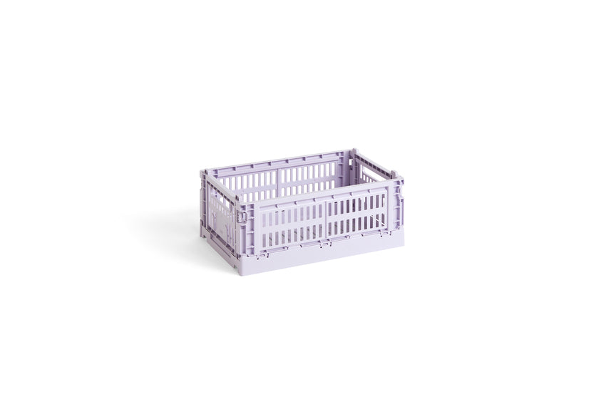 Side-angle view of the small HAY Colour Crate in a soft lavender purple, showcasing its stackable, ventilated industrial design made from recycled plastic.