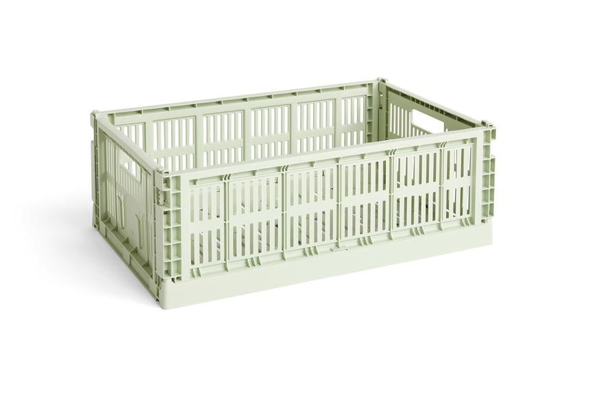 Side-angle view of the large HAY Colour Crate in a fresh mint green, showcasing its high-capacity, stackable, ventilated industrial design made from recycled plastic.