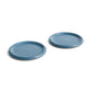 Side angle of two large 24cm HAY Barro terracotta dinner plates showcasing a rich high-gloss dark blue glaze and distinctive natural rolled edges.