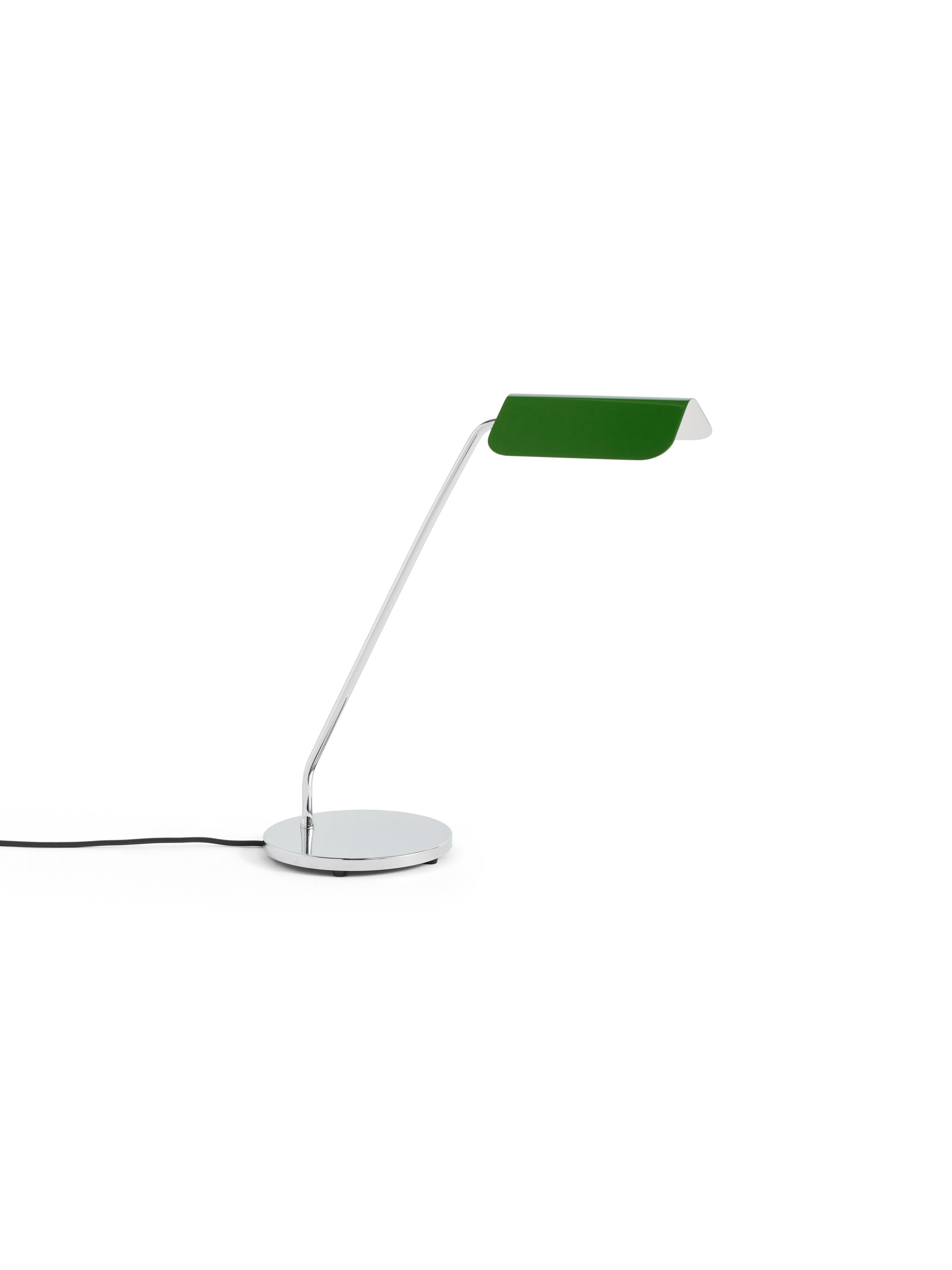 Side-angle view of the HAY Apex Desk Lamp featuring a folded steel shade in emerald green, contrasted against a sleek, chrome-plated angled base.