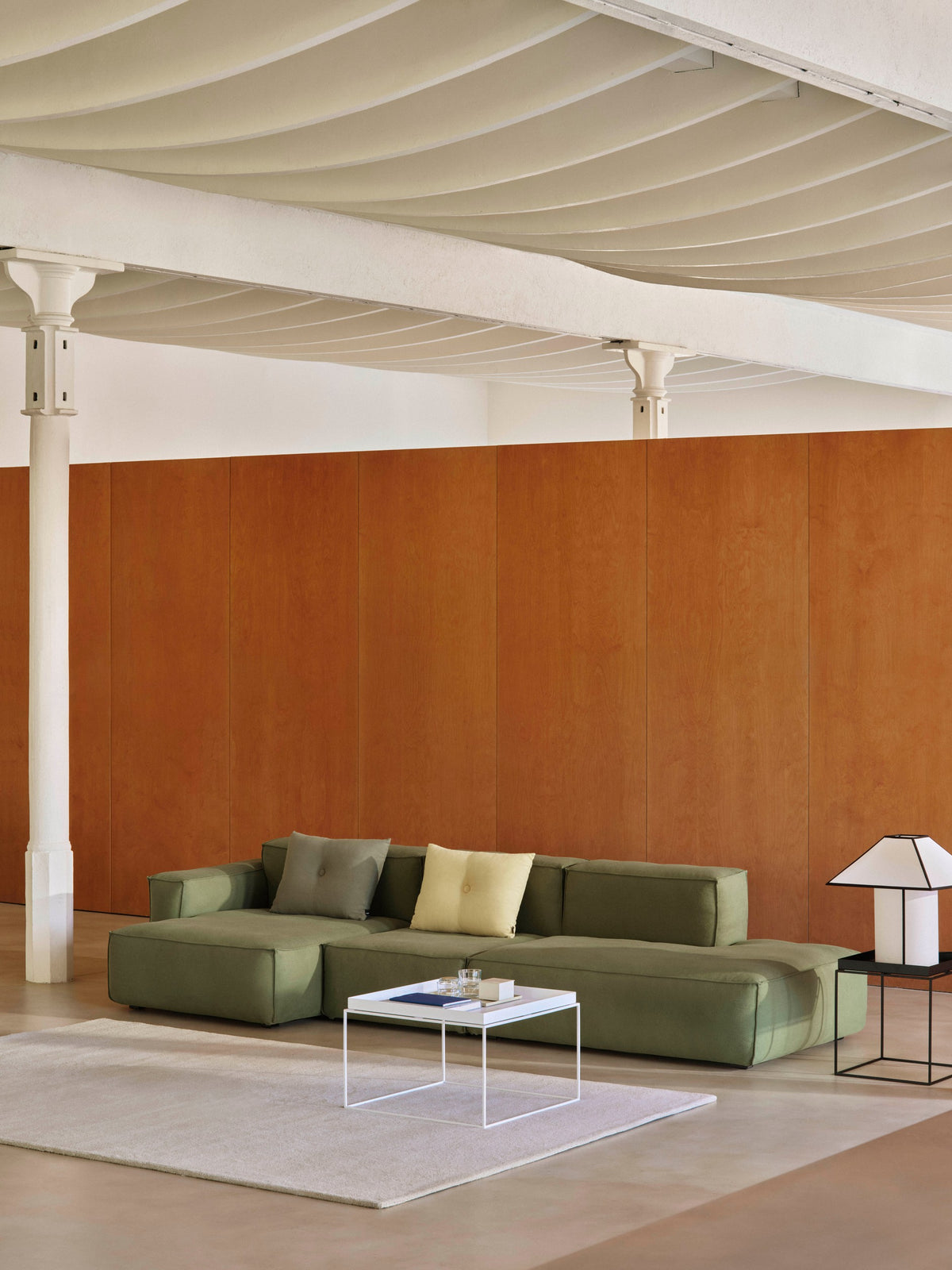 HAY Dot Cushions styled on contemporary sofa, with white coffee table. 