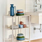 Hay Barro plates staked on a trolly in a kitchen. 