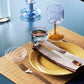 A pair of Hay colour sticks on a table setting.