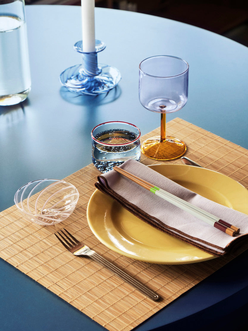 A pair of Hay colour sticks on a table setting.