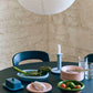 HAY Barro light blue terracotta oval dish on a dinning table, paired with Barro candle holder and butter dish. 