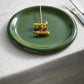 Hay Barro Plate 18cm in Green with skewered food on a white tablecloth