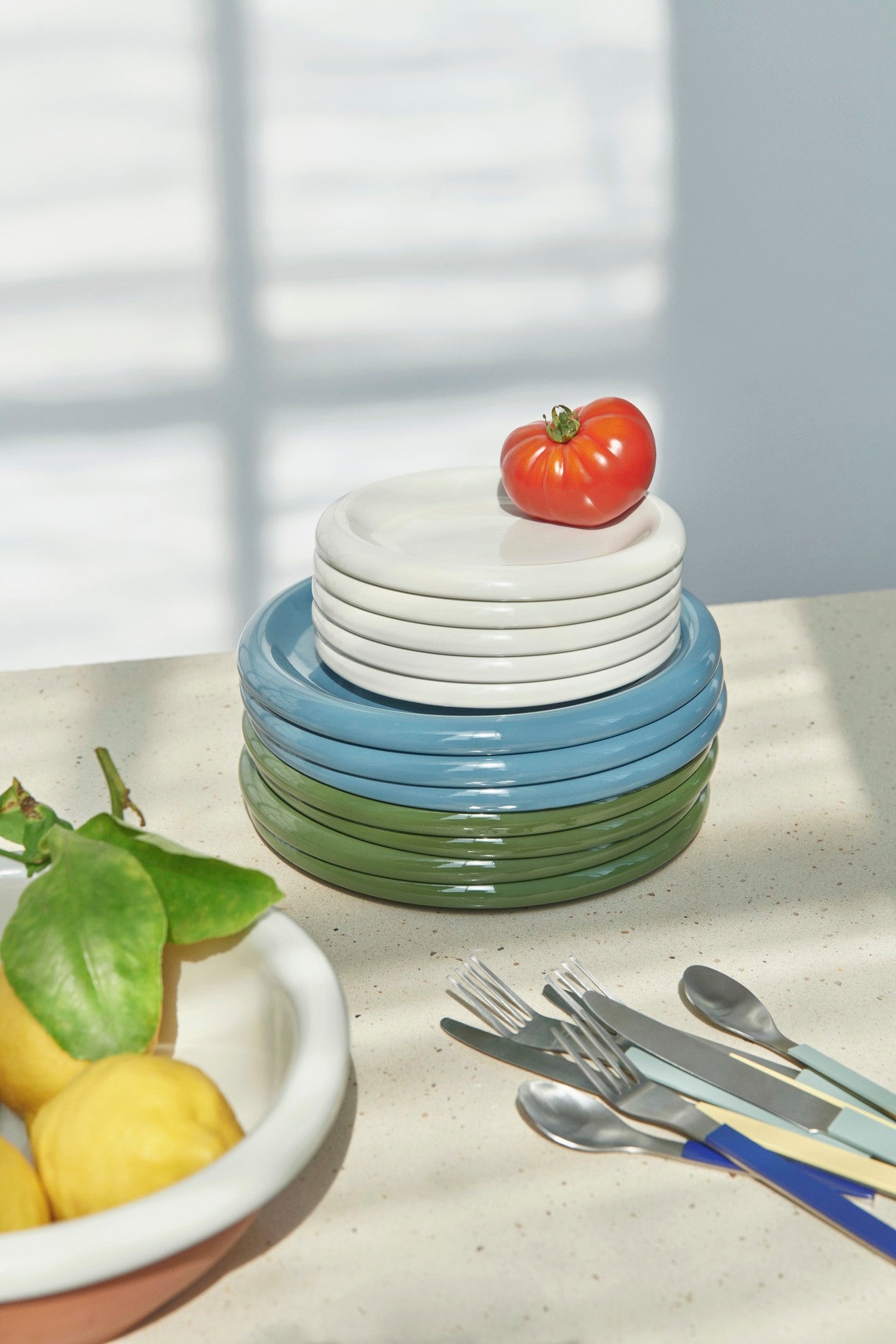 Stacked Hay barro plates in different colours and sizes. 